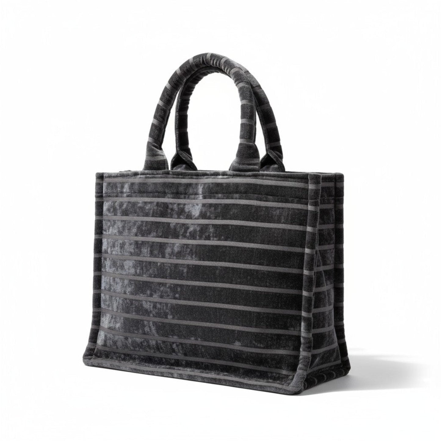 Front angle view of handmade black chenille Book Tote with striped detail and padded handles.