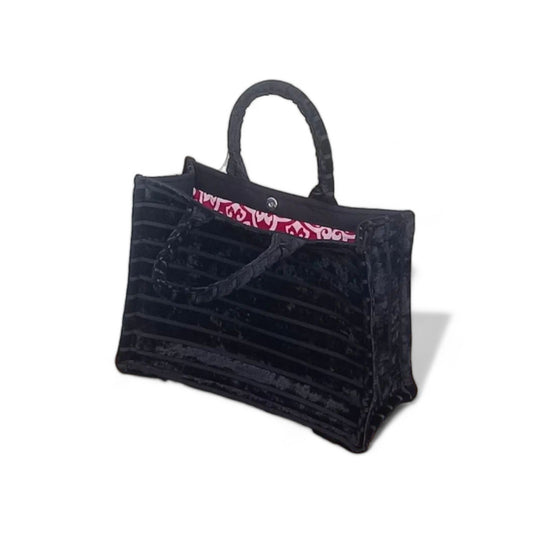 Top view of an open black chenille Book Tote, lined with raspberry damask fabric lining.