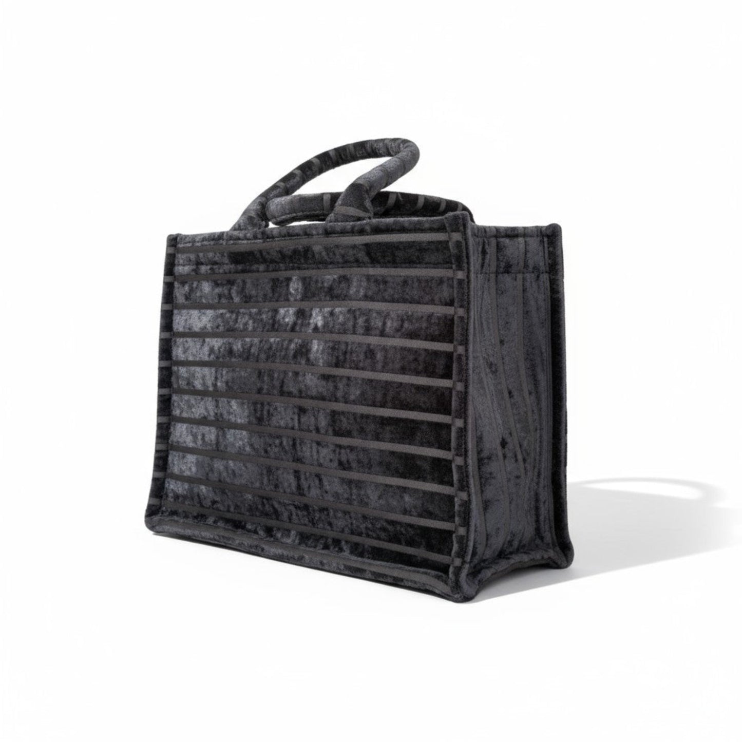 Side view of Black Chenille tote bag showcasing its striped velvet texture and durable construction.