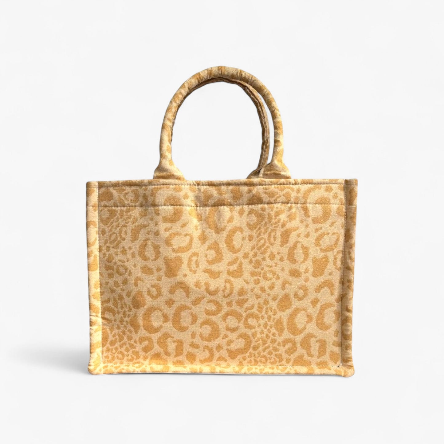 Front view of a yellow leopard handmade book tote with soft double handles and a structured design.