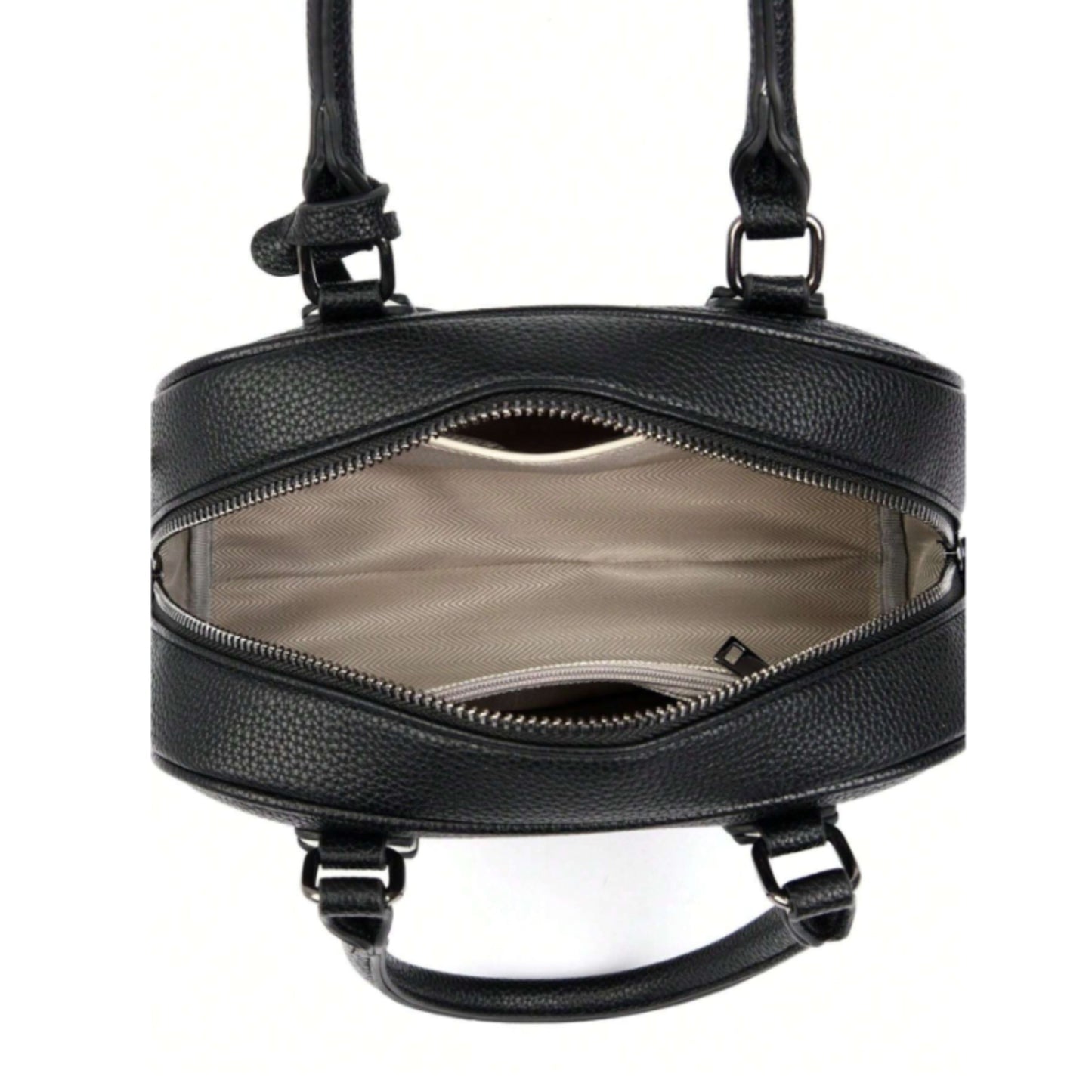 Interior of Celeste, a PU leather bowling bag showing 1 slip and 1 zip pocket, with beige fabric lining.