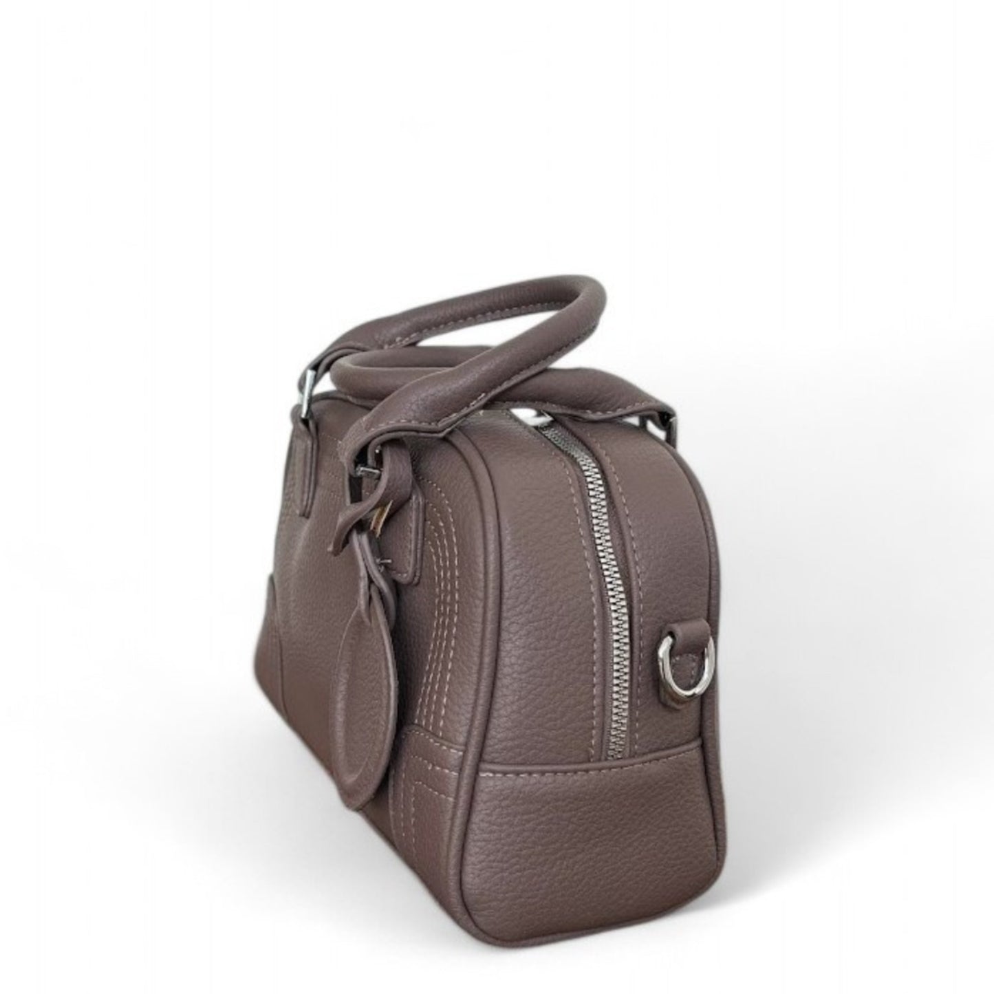 Side view of Celeste, a black PU leather bowling bag with double top handles, silver hardware & top zip closure.