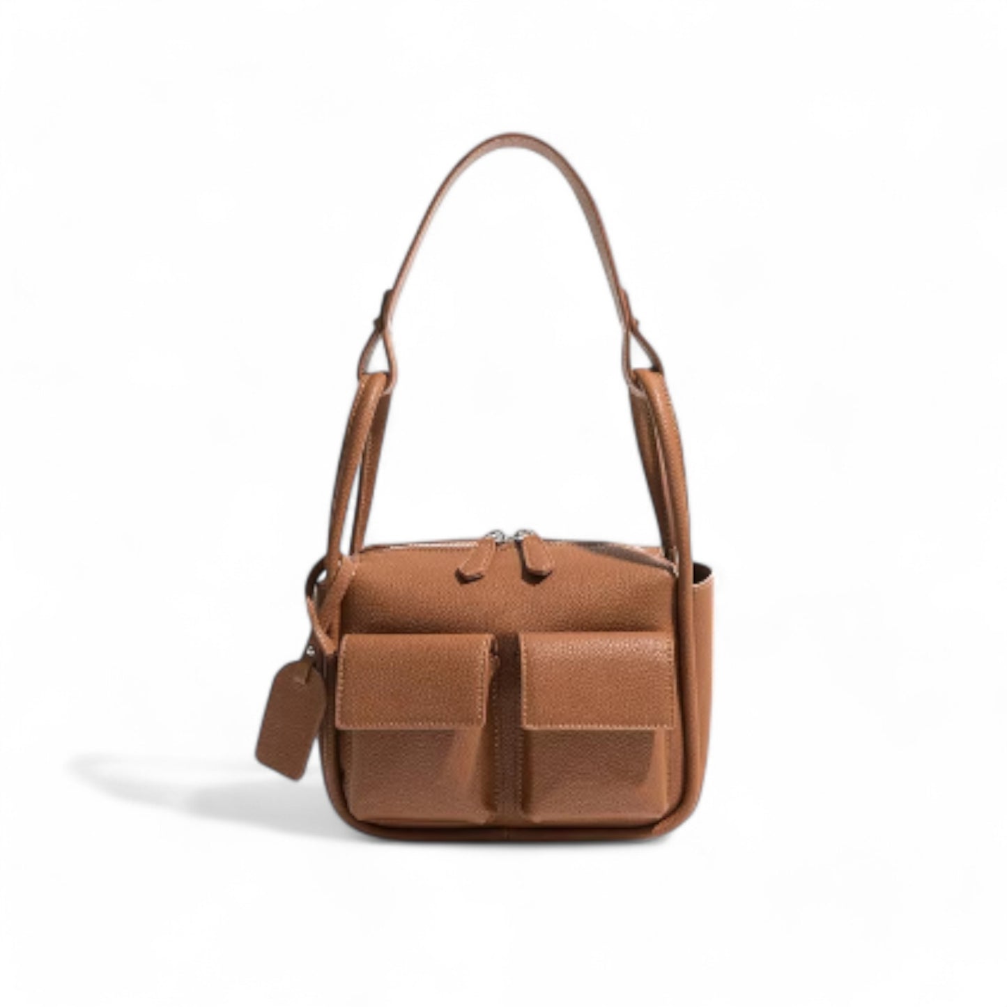 Front view of brown faux leather Dougie bag with two front flap pockets, top zip closure, and a detachable short shoulder strap.