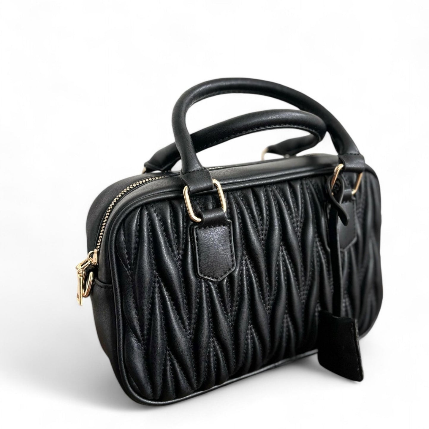 A black handbag with a quilted pattern, featuring gold-tone hardware & top handles.