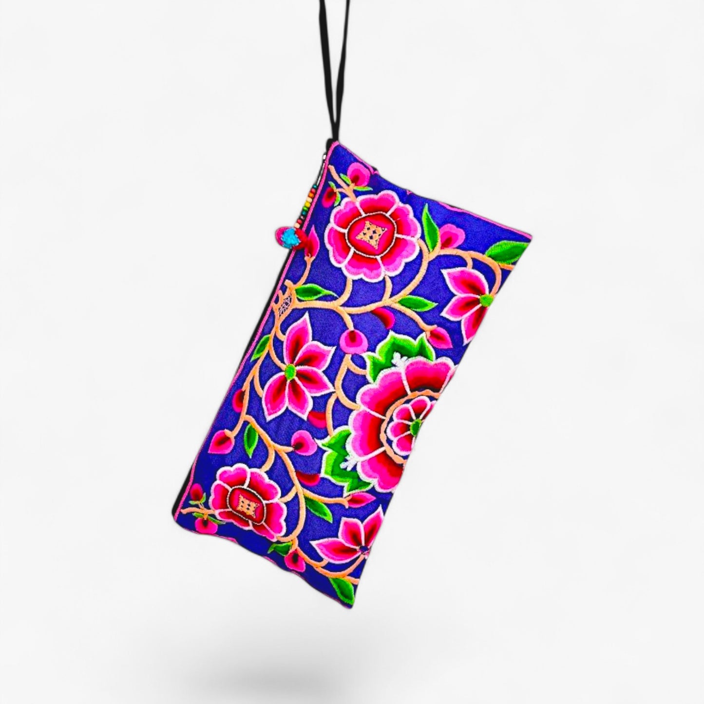Back view of a vibrant wristlet clutch featuring Hmong peony embroidery in pink, with a wrist strap.