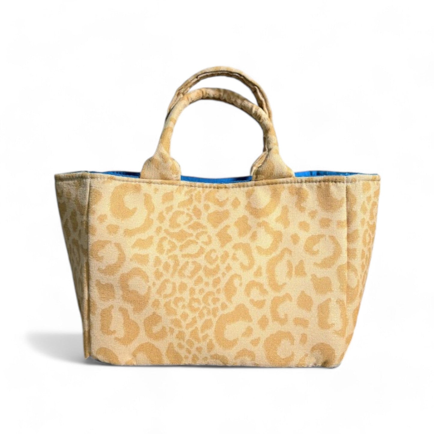 Handmade yellow leopard-print mini tote with top handles and blue lining seen from the front.