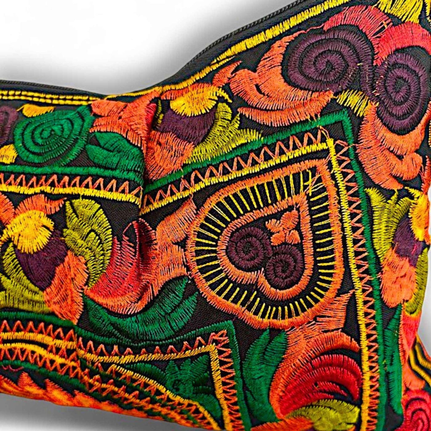 Close-up of a vibrant orange embroidered bird on a floral-patterned fabric.