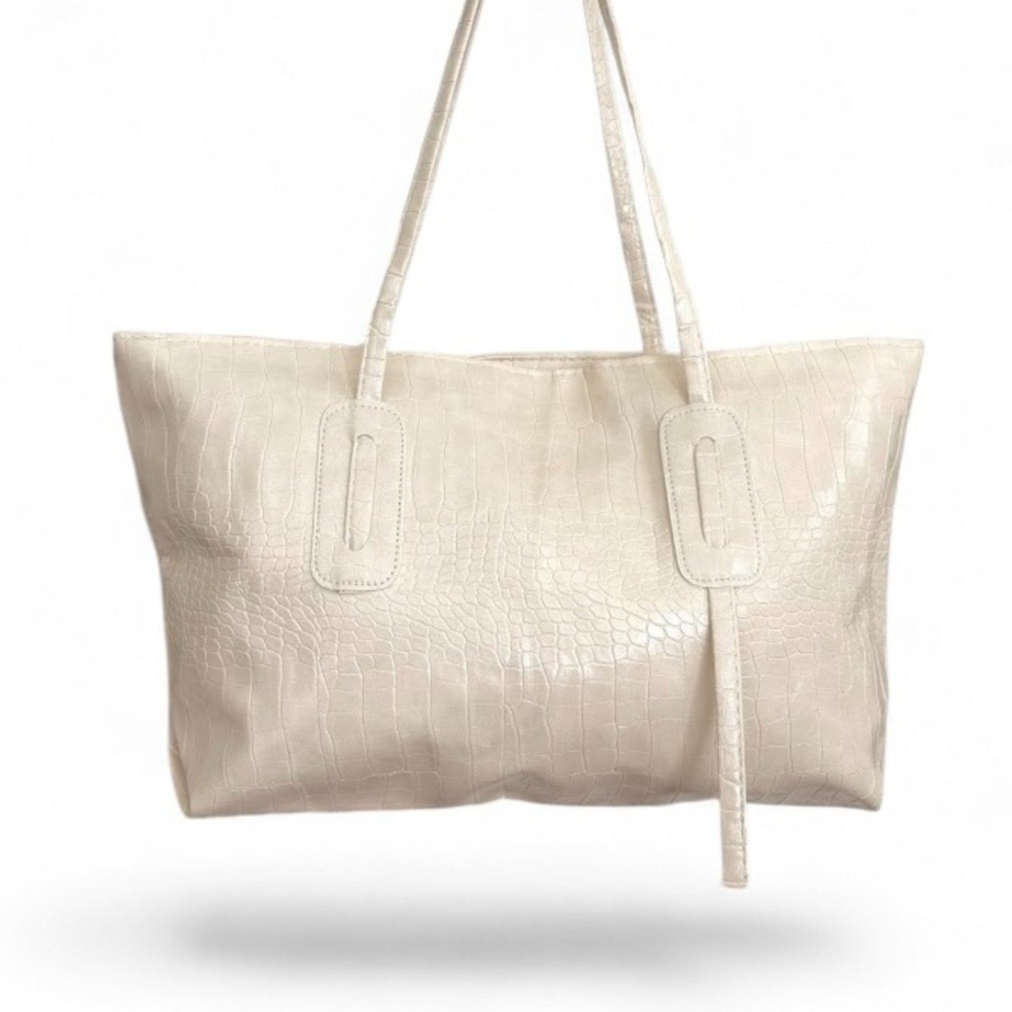 Off-white croc-textured Janine tote bag with double straps hanging from above.