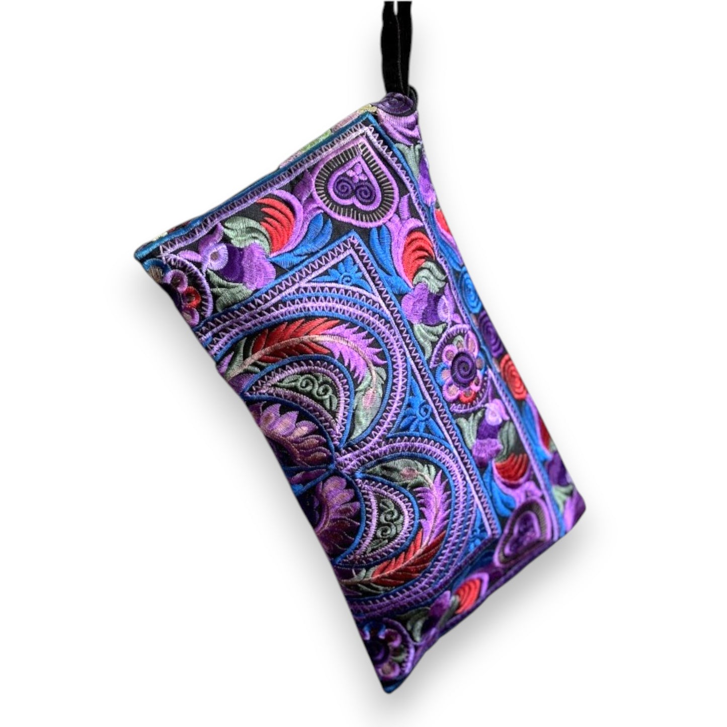 Purple, red, and blue embroidered paisley patterns on a black wristlet clutch with a strap.