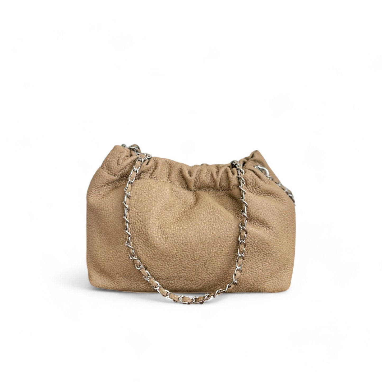 A beige leather handbag with a top ruched detail and a silver chain strap.