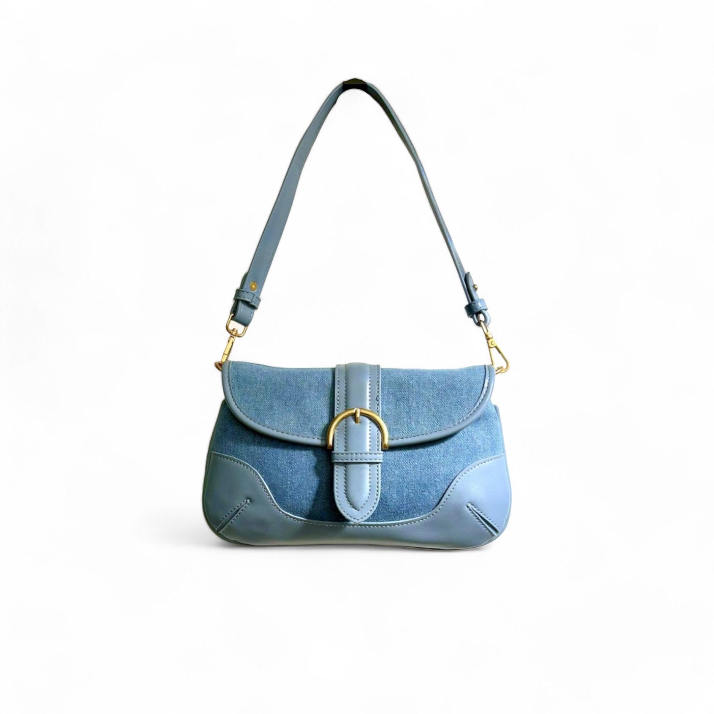 A blue denim shoulder bag with leather trim and a structured brass-tone buckle flap.