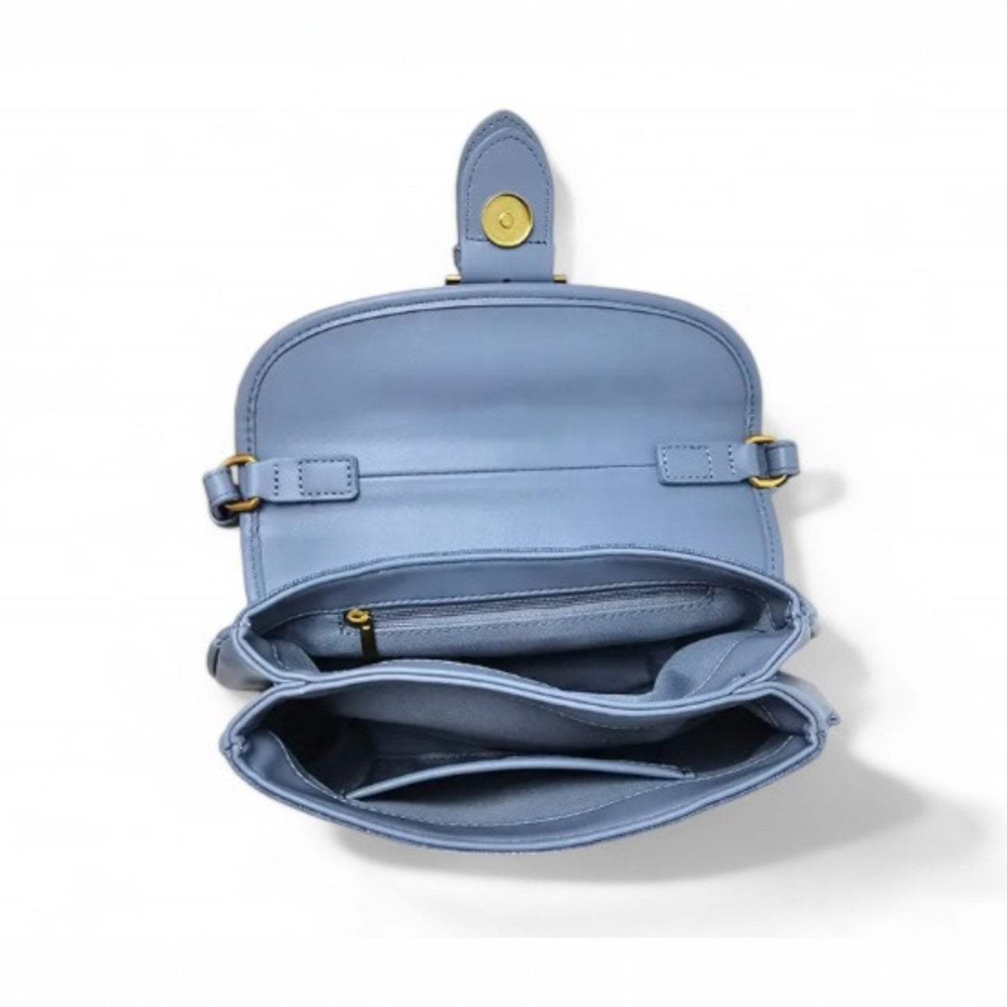 Interior view of a blue denim, fully lined bag with two compartments—one with a zip pocket, and the other with a slip pocket.