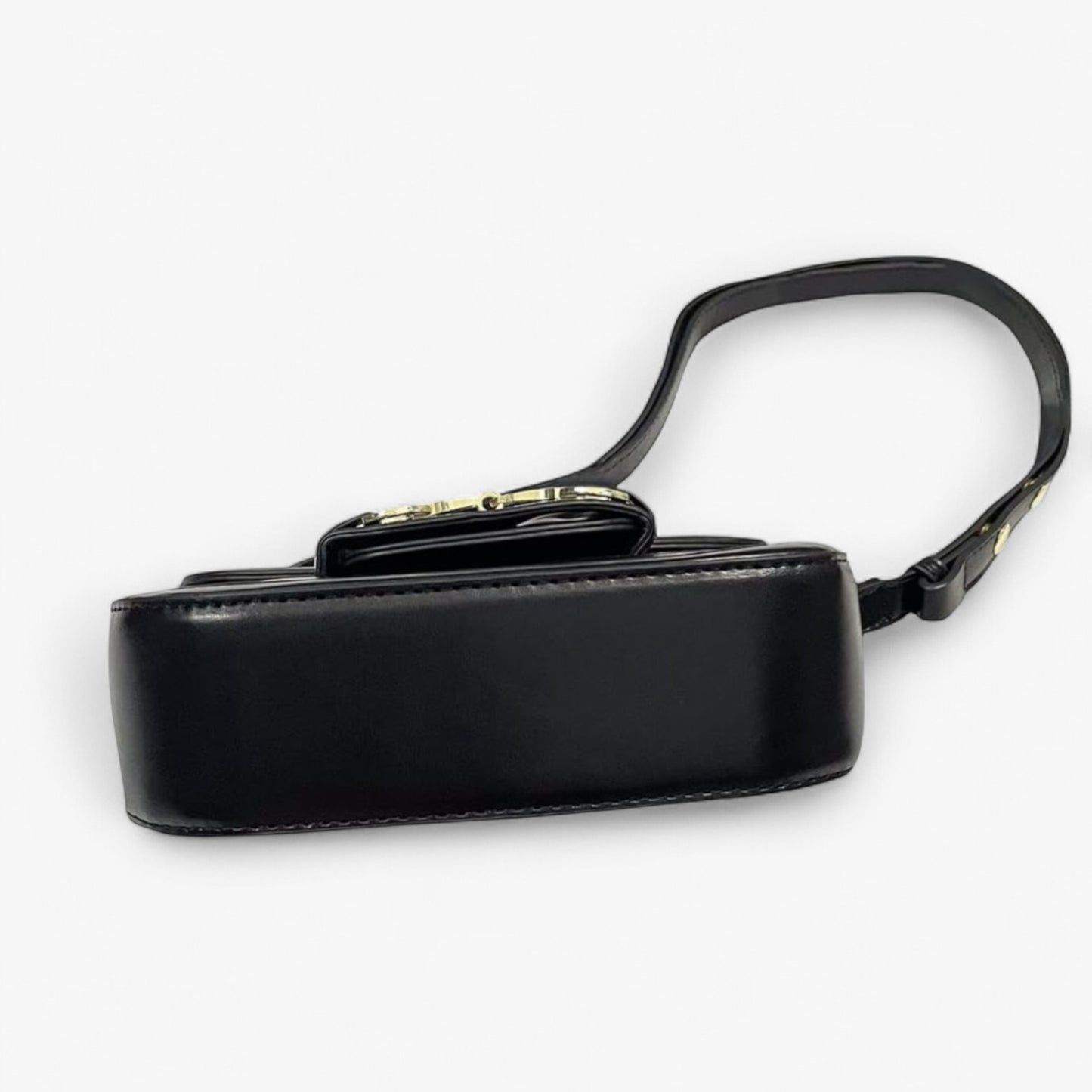 A base of a black handbag with a strap and gold accents.
