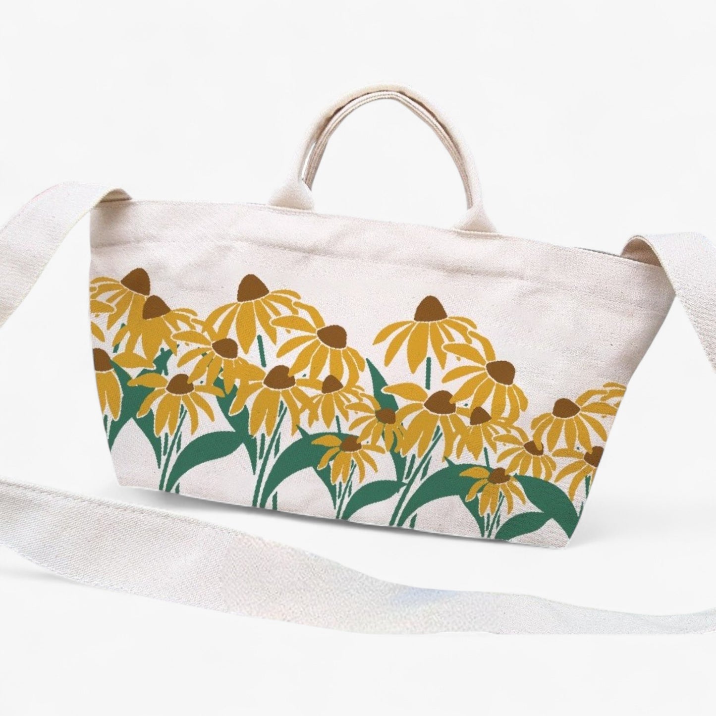 Eco-friendly canvas tote with sunflower design, crossbody strap, and top handles.