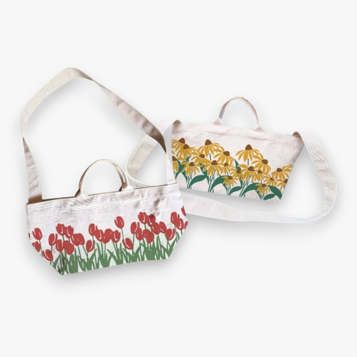 Flat lay of two canvas totes, one with sunflowers and one with red tulip prints.