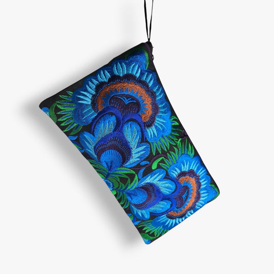 Hanging handmade blue floral embroidered wristlet clutch bag with strap.
