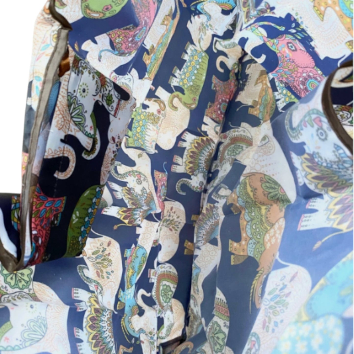 Inside of a navy tote bag with colourful elephant patterns showing large capacity.