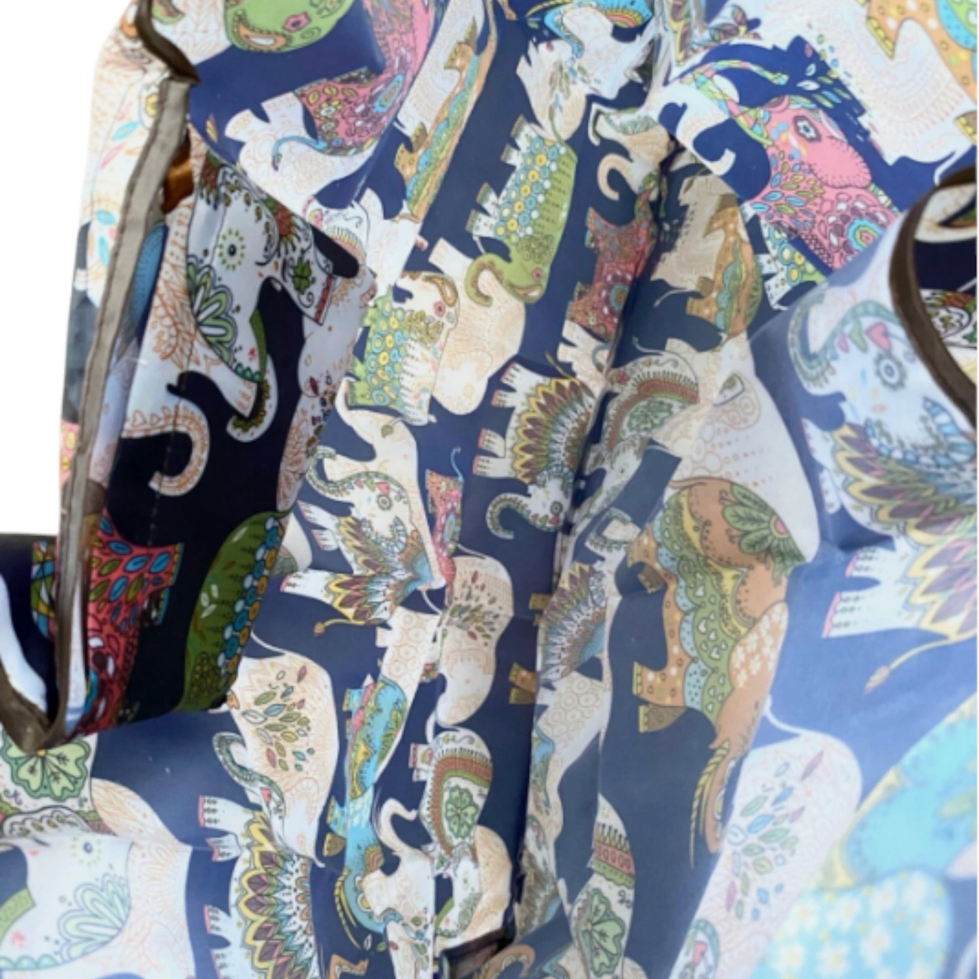 Inside of a navy tote bag with colourful elephant patterns showing large capacity.