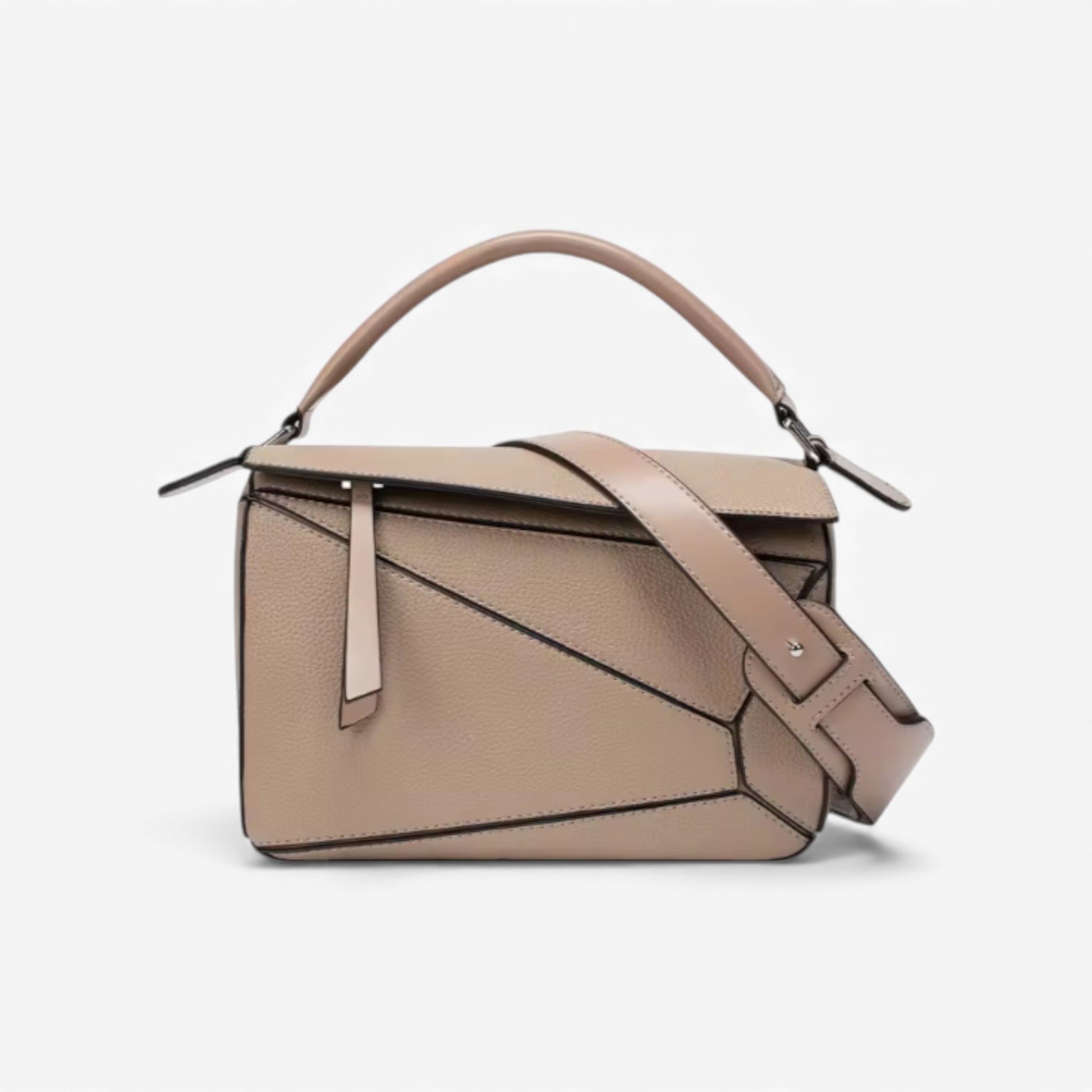 A beige handbag with geometric panels, a top handle, and a crossbody strap. Perfect minimalist everyday bag.