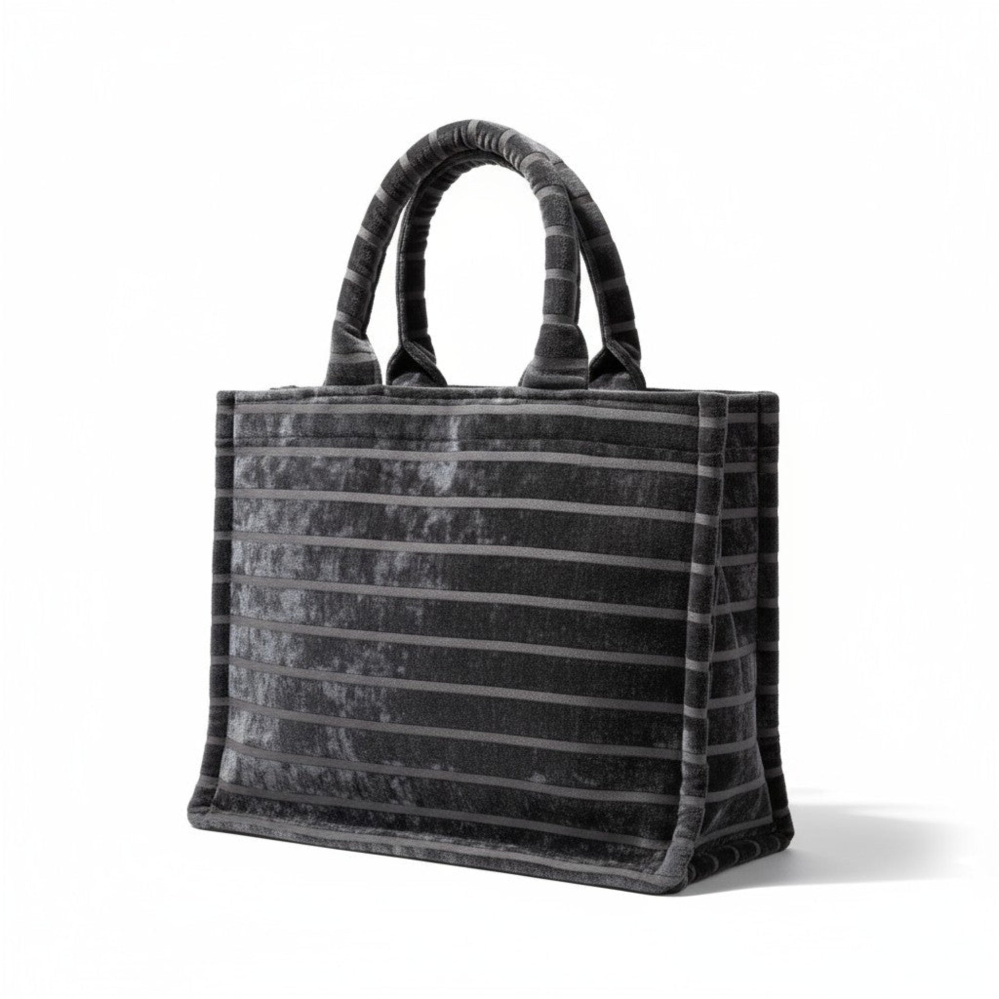 Front angle view of handmade black chenille Book Tote with striped detail and padded handles.