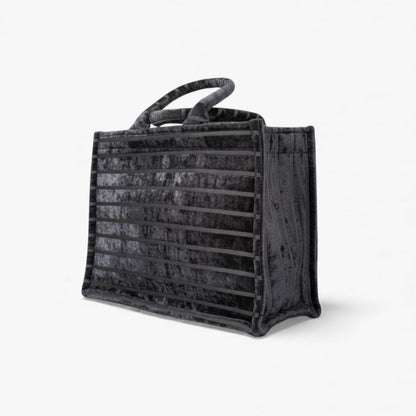 A angled view of a structured black tote with horizontal stripes and great for students or office essentials.
