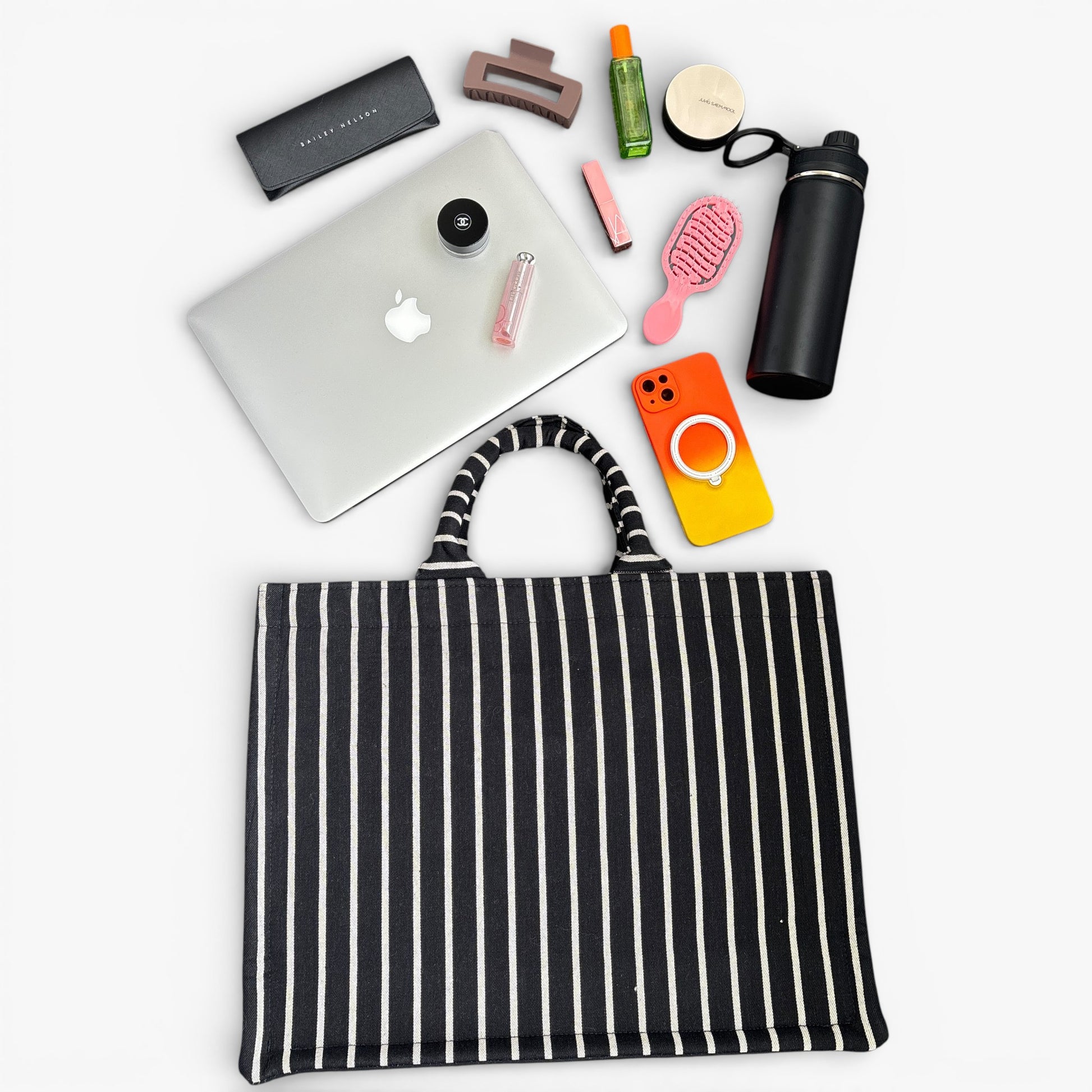 Black-and-grey vertical-striped book tote bag with handles, a roomy interior for a laptop and daily essentials.