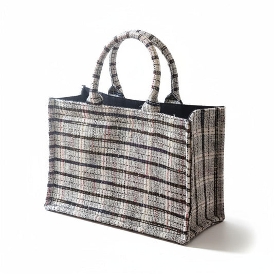 A white tweed book tote with top handles in a front angled view.
