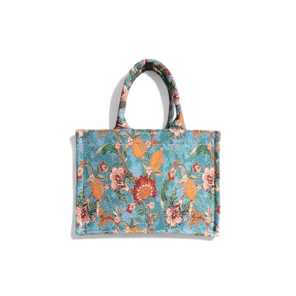 Front view of the Vintage Blue Book Tote, a handmade fabric bag with vintage romantic floral prints.