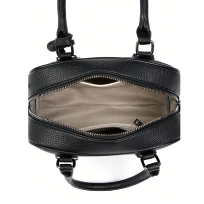 Interior of Celeste, a PU leather bowling bag showing 1 slip and 1 zip pocket, with beige fabric lining.