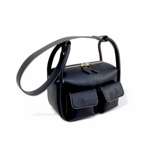 Angel view of black faux leather Dougie bag with two front flap pockets, top zip closure, and a detachable long shoulder strap.