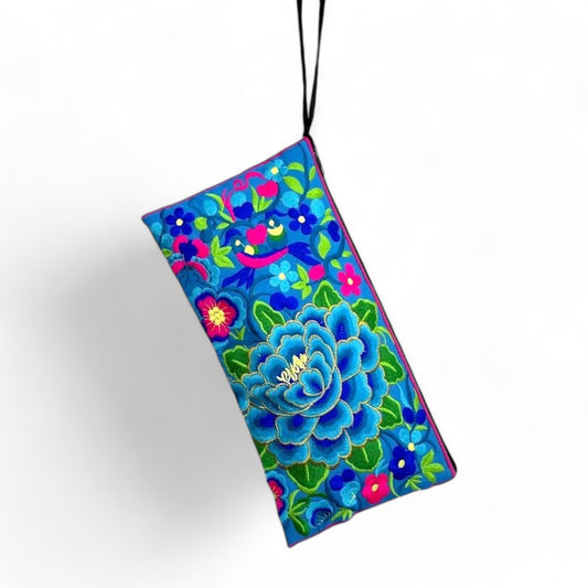 Handmade wristlet with vibrant blue dahlia embroidery,  ideal for everyday use or as a unique gift.