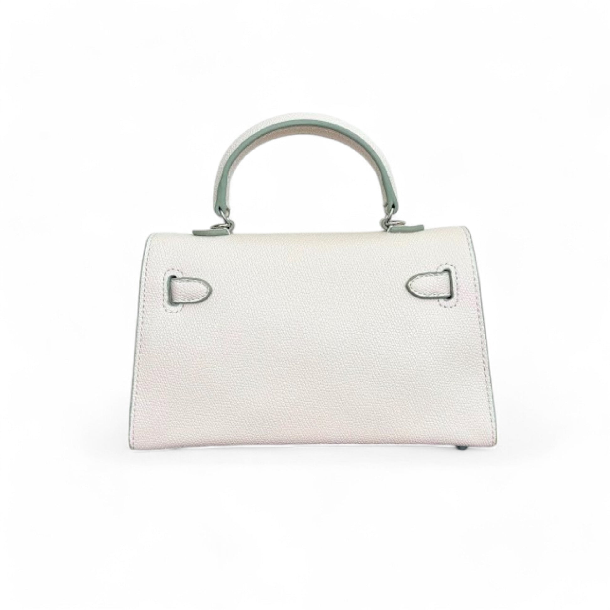 Back view of a white structured trapezoid shape mini top-handle bag.