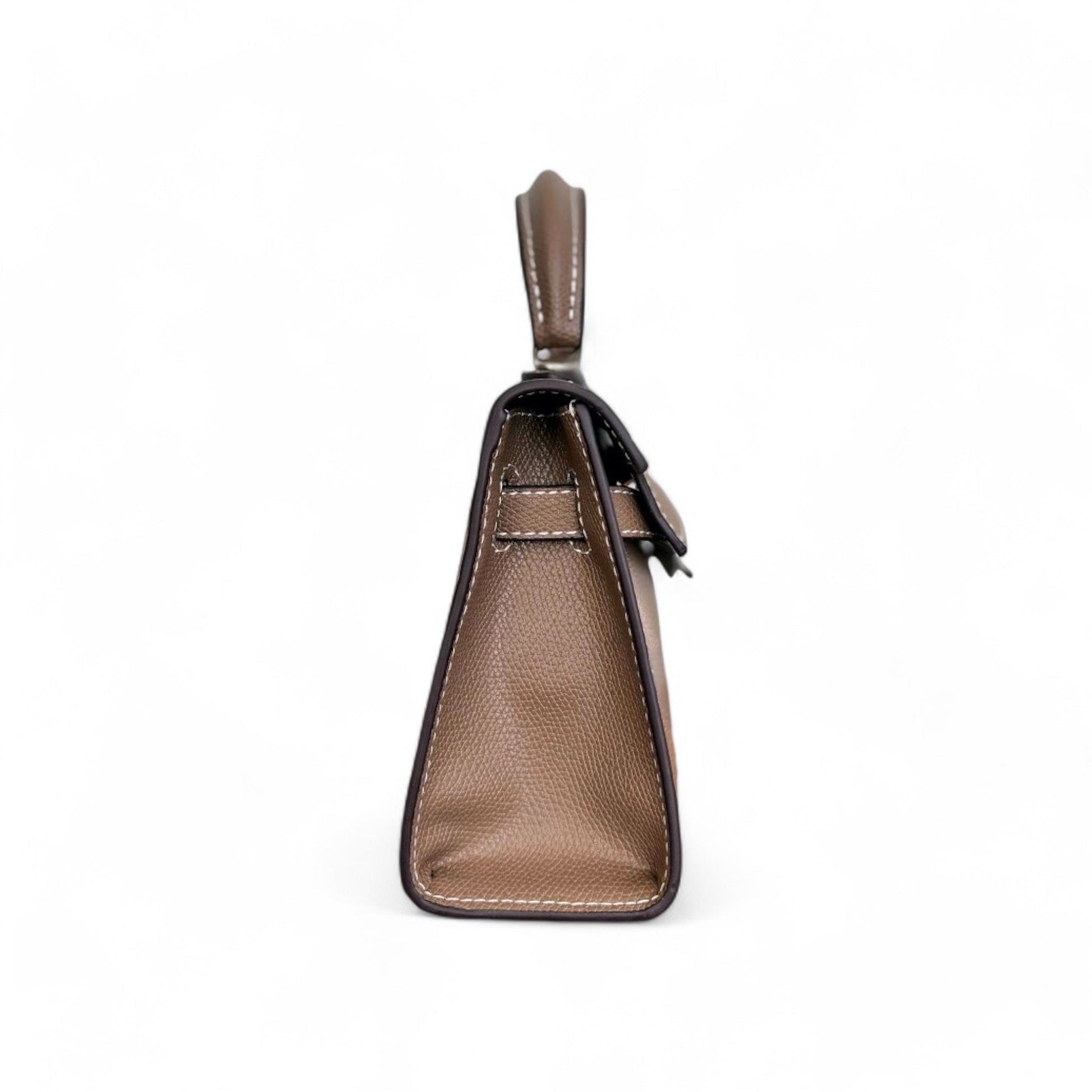 Side view of taupe mini top-handle bag with contrast stitching and structured base.