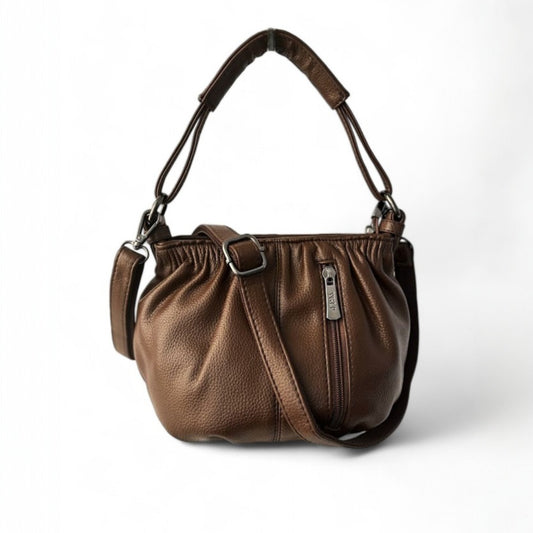 Front view of a coffee pleated bucket bag with a vertical zip pocket, a top handle and a shoulder strap.