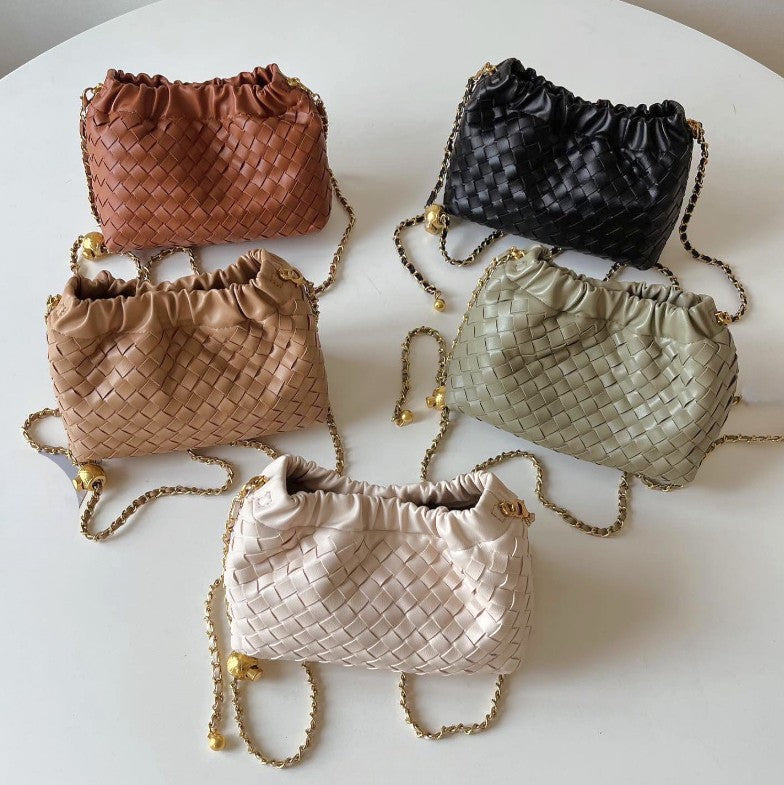 Hand-oven leather mini shoulder bags with gold chain in five colours: black, brown, tan, sage, and cream.