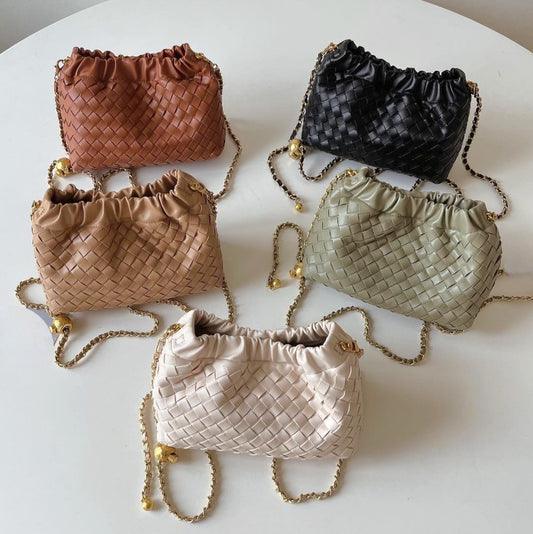 Hand-oven leather mini shoulder bags with gold chain in five colours: black, brown, tan, sage, and cream.
