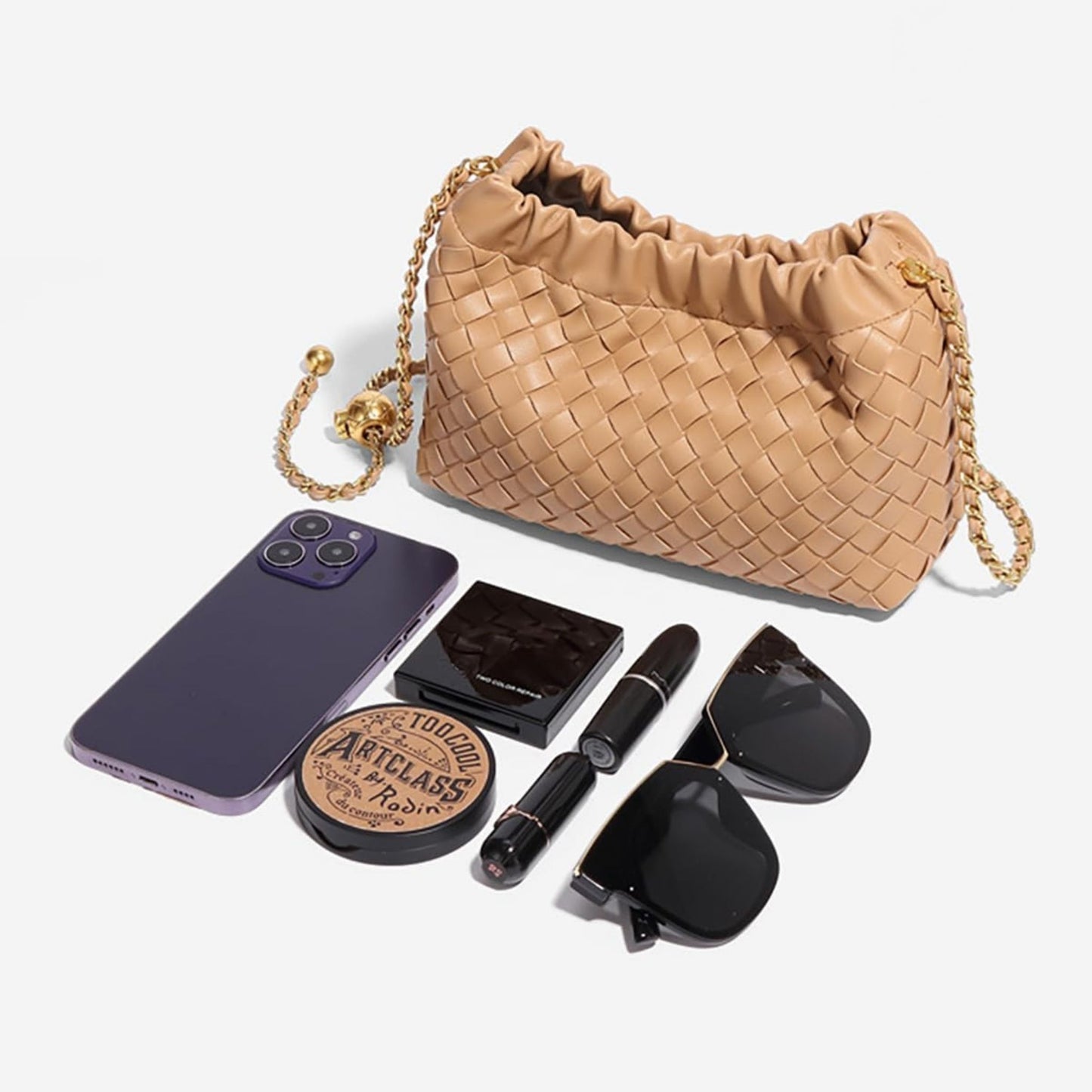 Tan woven bag with its content lying out neatly in front.