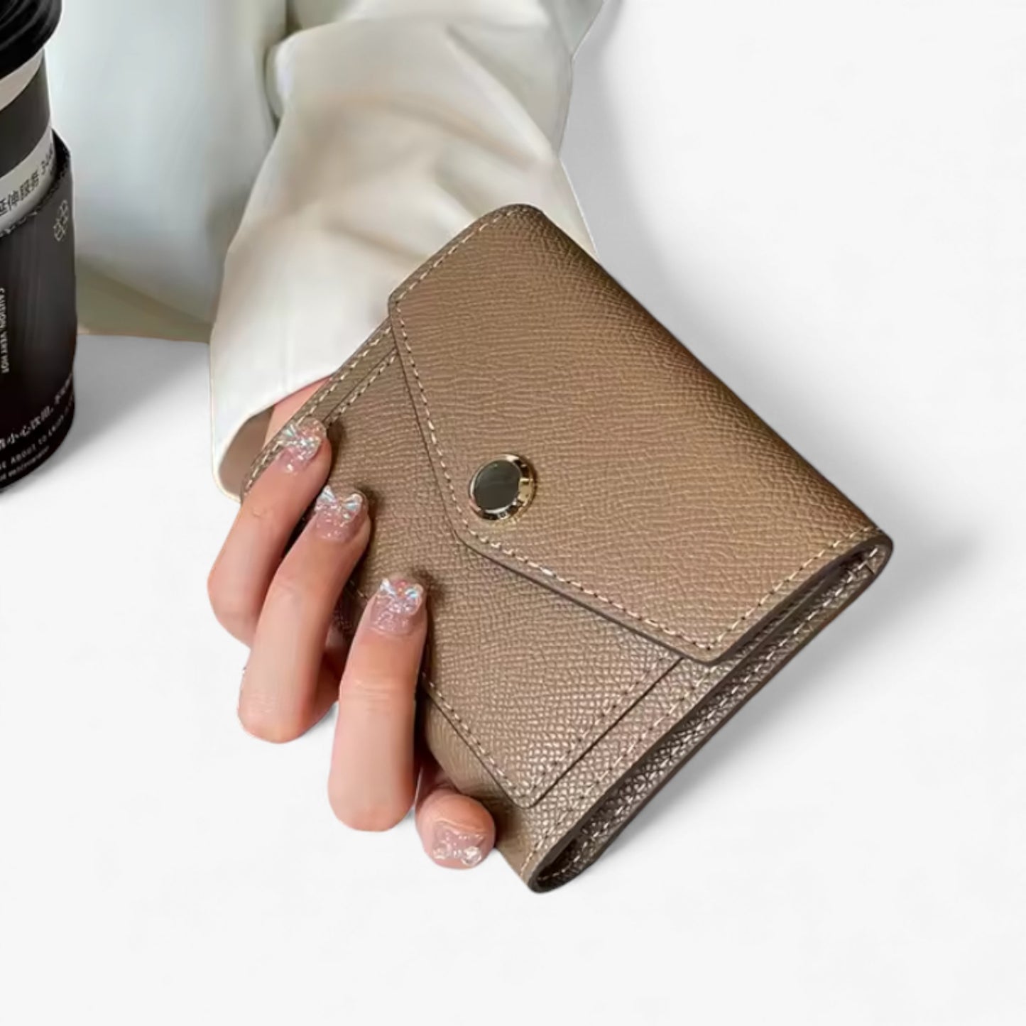 Compact khaki Epsom-textured vegan leather wallet with contrast stitching and a gold snap button.