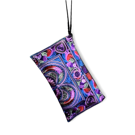 Purple and blue embroidered paisley-patterned wristlet pouch with a strap.