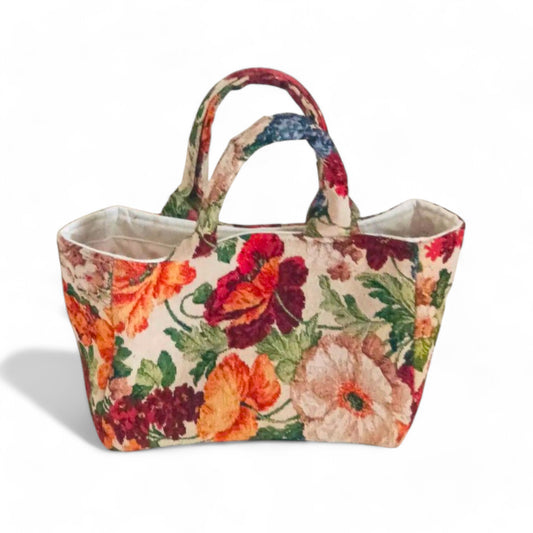Mini tote bag with floral patterned and light coloured lining.
