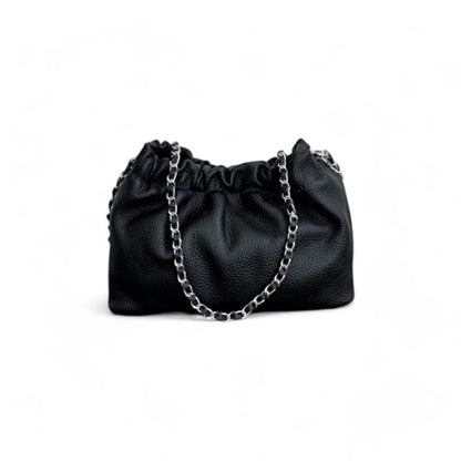 Black leather handbag with top ruched detail and a silver chain strap.